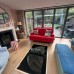 Hinged Glass Cellar Door Over a Spiral Staircase, London Living Room